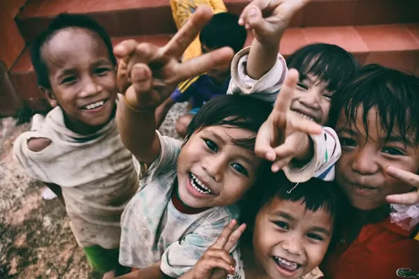 Children smiling together happily in community